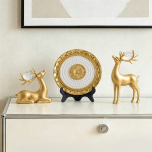 Elegant 3-piece decorative deer plate set featuring golden deer figurine set and stand.