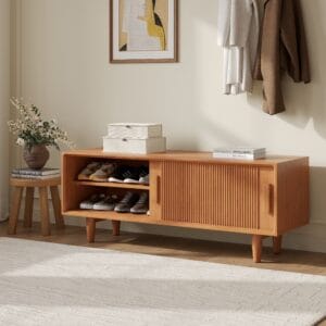 Elegant entryway bench with storage featuring a sliding door and natural wood finish.