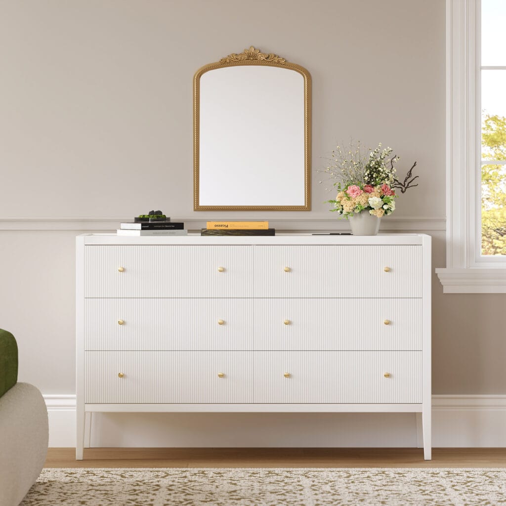 Stylish Stria 47" fluted white dresser with charging station offers organized storage and modern convenience.