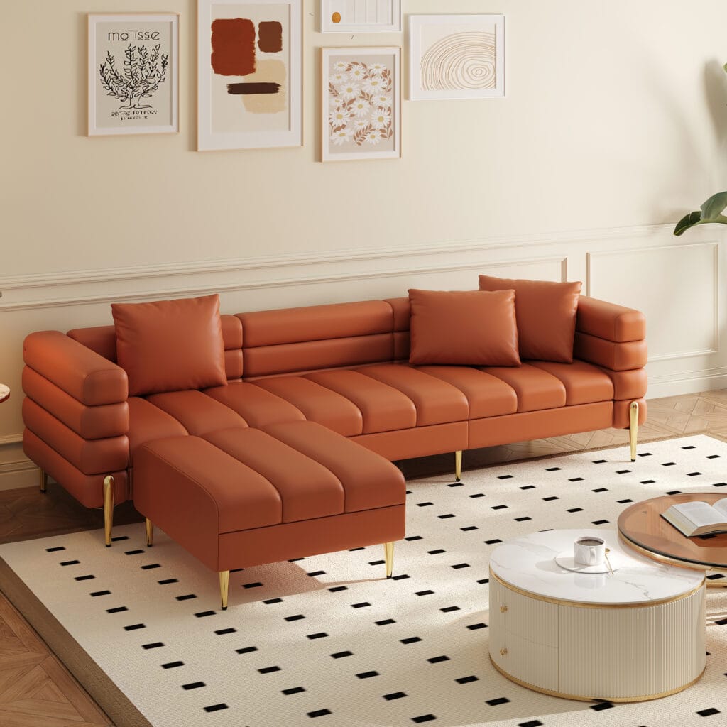 Modern elegance embodied in a faux leather modular couch with tufted silhouette and gold-tone legs.