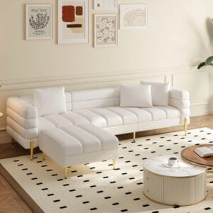 Modern leather sectional sofa featuring a tufted design and sleek gold-tone legs.