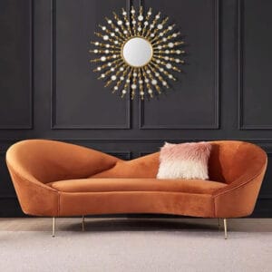 Indulge in comfort with this modern orange velvet sofa featuring plush upholstery and sleek metal legs.