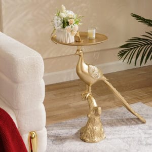 Elegant gold peacock end table features a luxurious base and spacious round tabletop.