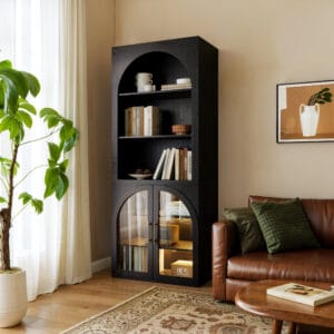 Tall black storage cabinet featuring arched glass doors and motion-sensor LED lighting, perfect as a black bookshelf with light.