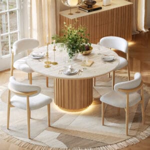 Round dining table featuring a faux travertine sintered stone top and fluted pedestal base.