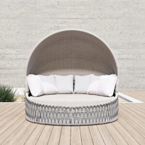 Experience comfort and style with this outdoor patio daybed with canopy designed for versatile lounging.