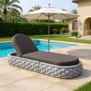 Relaxing on a Cocaro chaise lounge outdoor featuring adjustable backrest and weather-resistant cushion.