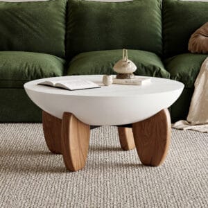 Concrete coffee table with a desert sand finish and smooth round design for safety.