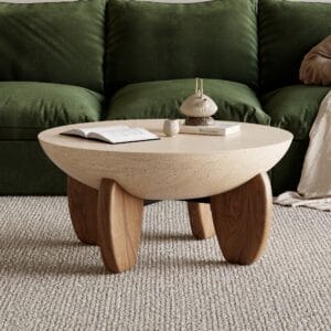 Round concrete coffee table featuring a desert sand finish and smooth, round design.