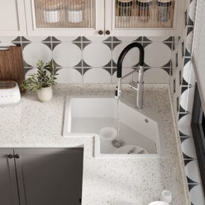 Contemporary Irregular kitchen sink designed for drop-in installation in a corner.