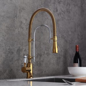Elegant solid brass kitchen faucet featuring a porcelain handle and high arc spout.