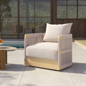Relaxed outdoor lounging on a Costra swivel lounge chair with breathable rope and cushion.