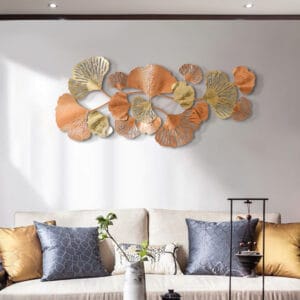 Cascading ginkgo leaf wall art crafted from hand-finished metal with a gold finish.