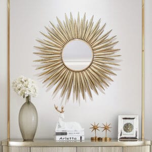 Sculptural sunburst frame surrounding a distortion-free glass, large sunburst wall mirror.