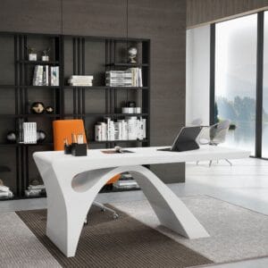 Sculptural arched base supports a modern writing desk with glossy finish and curved edges.
