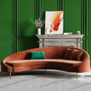 Plush velvet upholstery adds comfort to this modern curved velvet sofa with a sculptural silhouette.