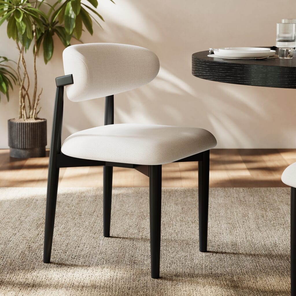 Stylish black linen dining chair featuring an ergonomic curved back for optimal support.