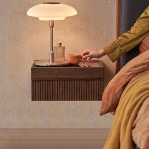 Floating walnut veneer nightstand set featuring a glass top and rounded edges.