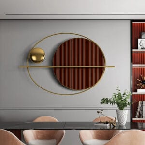 Modern geometric wall decor featuring a brown ridged circle and a metallic sphere.