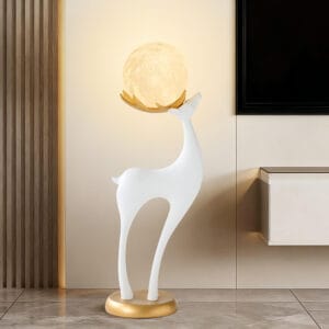Elegant 30" tall modern resin deer floor lamp with remote featuring antlers cradling a glowing ball.