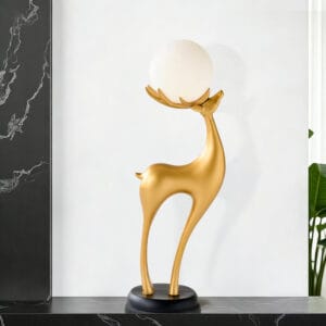 Stylish 30" tall modern resin deer floor lamp featuring antlers that hold a glowing ball.