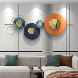 Bold orange, navy, and teal circles create a striking modern round metal wall art design.