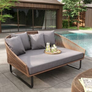 Stylish 63" Rattan Outdoor Daybed with plush gray cushions, perfect for lounging.