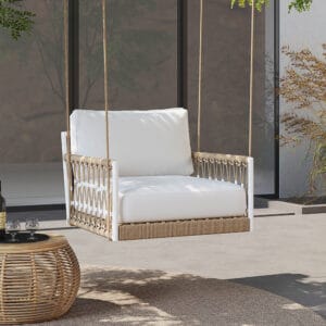 Boho-style outdoor swing sofa with hand-woven rope and weather-resistant aluminum frame.
