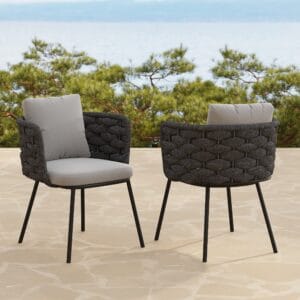 Sleek aluminum frame and woven rattan design create modern outdoor dining chairs.