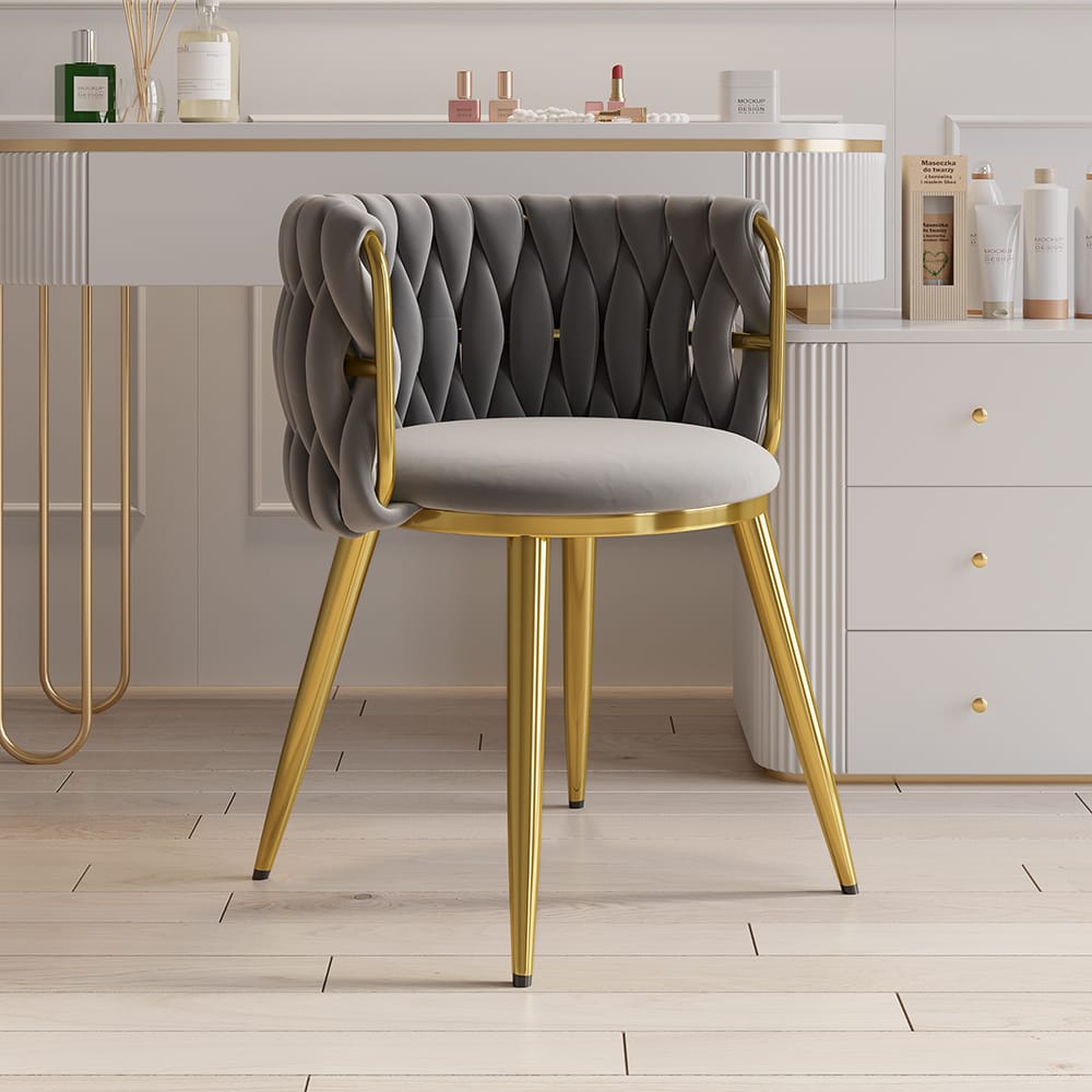 Plush velvet upholstered barrel back dining chair with foam padding and sturdy stainless steel base.