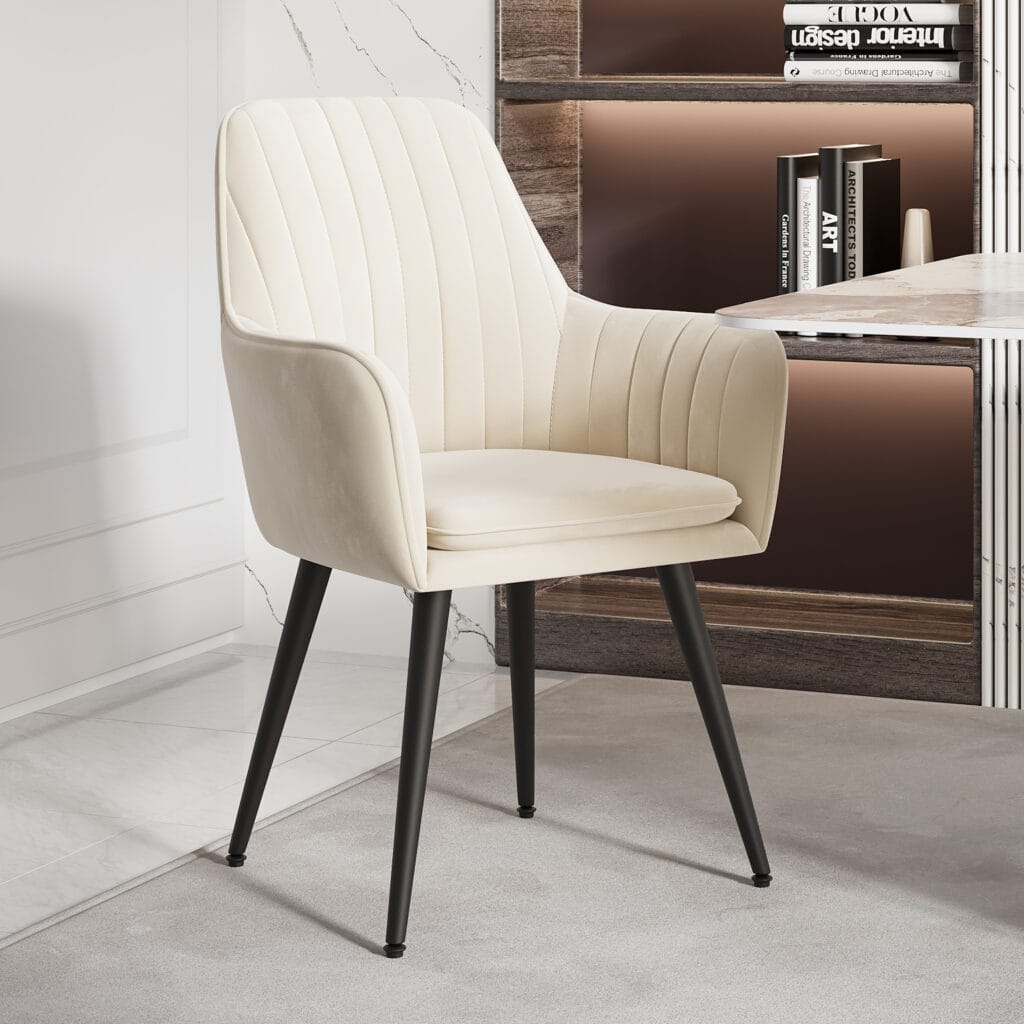 The Sicotas Collection 31 Stylish beige velvet dining chairs set with padded seats and black metal legs for comfort.