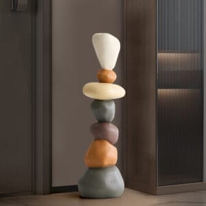 Stunning stacked resin stone sculpture featuring balanced layers in earthy tones.