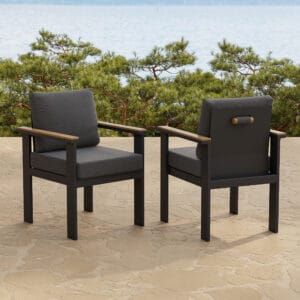 Stylish Tevara outdoor dining chairs featuring durable teak accents and a rust-resistant aluminum frame.