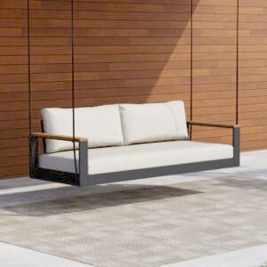 Tevara outdoor hanging swing chair offers modern comfort and natural teak accents for relaxation.