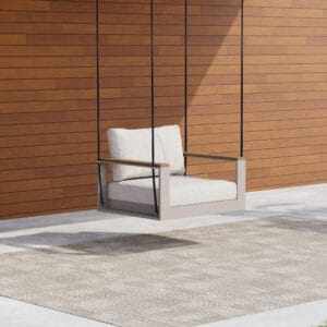 Tevara outdoor hanging chair features natural teak accents for a stylish outdoor retreat.