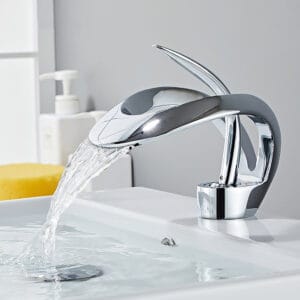 Sleek chrome bathroom sink faucet featuring a waterfall flow and single-handle operation.